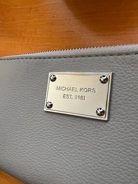 Michael Kors Pale Gray Pebbled Zip Wallet with Silver Plaque